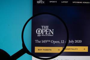 The Open Championship logo on a computer screen with a magnifying glass