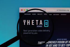 Theta Token logo under magnifying glass
