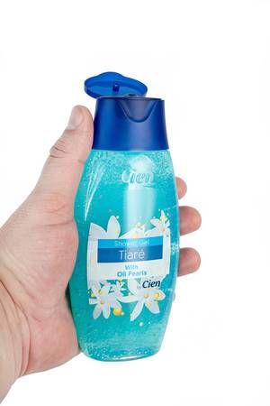 Tiare Showering Gel in the hand above white background