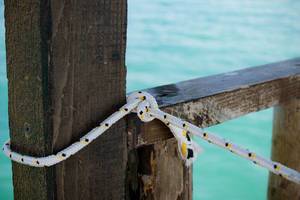 Tied rope on sea background
