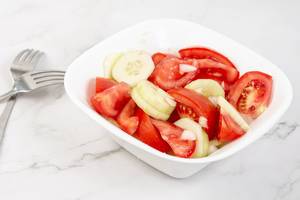 Tomato Cucumber and Onion Salad in the bowl