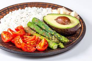 Tomatoes, asparagus, avocado and boiled rice. The concept of healthy food (Flip 2019)