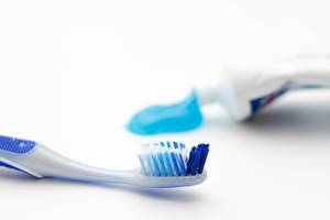 Toothbrush with Paste in the Background