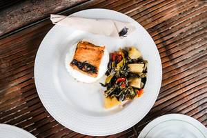 Top shot of a milkfish dish with vegetables on side (Flip 2019)