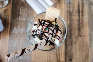 Top shot of vanilla ice cream with toppings