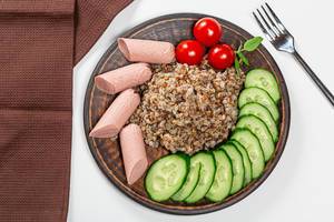 Top view buckwheat with sausages and vegetables