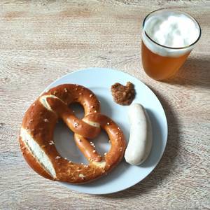 Top View Food Photo of Traditional Bavarian German Breakfast Weisswurst with Pretzel, Sweet Mustard and Beer