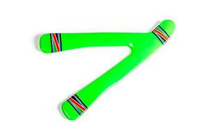 Top view, green plastic boomerang on white background