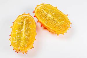 Top view, halves of kiwano fruit on a white background