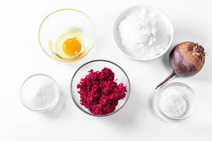 Top view, ingredients for making beetroot pancakes on a white background (Flip 2019)