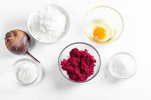 Top view, ingredients for making beetroot pancakes on a white background
