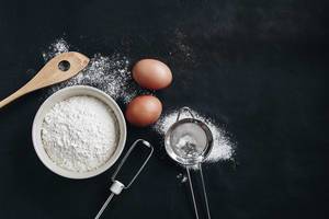 Top view of baking background with flour and cooking supplies