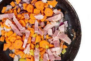 Top view of Carrot Paprika and Bacon in the frying pan (Flip 2019)