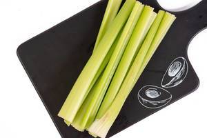 Top view of Celery Sticks on the black tray