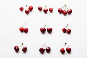 Top view of cherries on white background