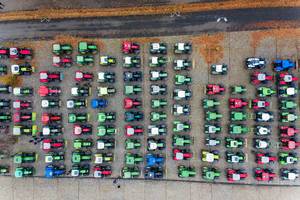Top view of colorful tractors - German farmers protest environmental protection policy and governments agricultural package