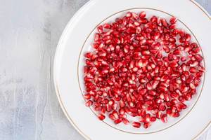 Top view of Fresh Pomegranate on the white plate