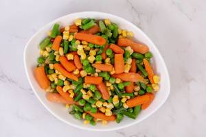 Top view of Fresh raw Carrot Peas Corn and Green Beans (Flip 2019)