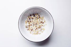 Top view of muesli with milk in a bowl. Healthy breakfast.