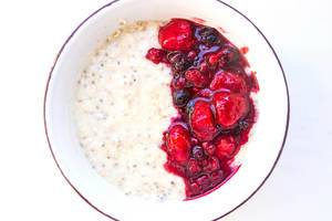 Top view of oat porridge with berry compote