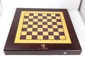 Top view of the entire battery-powered wooden chessboard from Square Off, playable against AI (artificial intelligence)