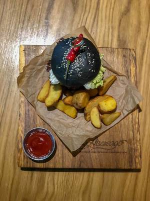 Top view of Veg Kuro burger at Avocado Cafe
