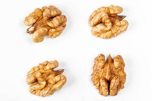 Top view of walnut kernel on a white background (Flip 2020)