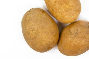 Top view of Whole Potatoes isolated above white background