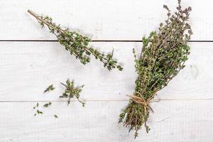 Top View Photo of Fresh Herb Thyme on a White Wooden Table