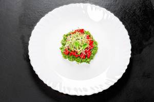 Top view vegetarian salad with fresh vegetables and onion seed sprouts on a white plate (Flip 2019)