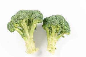 Topv view of Fresh Broccoli above white background
