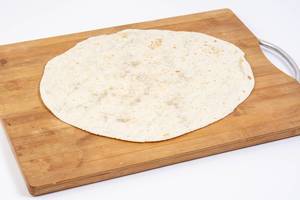 Tortilla on the wooden kitchen board