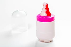 Toy baby bottle with a nipple-Lollipop on a white background (Flip 2019)