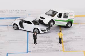 Toy cars on accident statement report