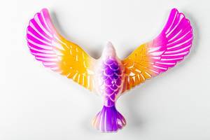 Toy eagle with spread wings on a white background (Flip 2020)
