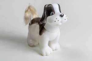 Toy figure of a dog on a white background