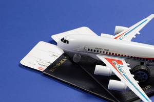 Toy plane on passports and tickets