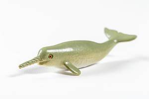 Toy whale narwhal on a white background (Flip 2019)