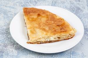 Traditional Balkan cheese pie Burek served on the plate