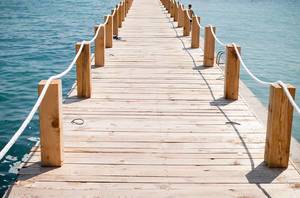 Travel Photo of Wooden Footbridge to the Sea in the Summer