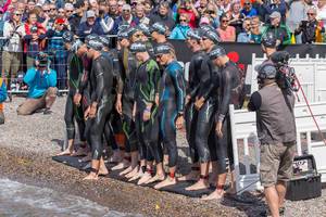 Triathlon competitors ready for their swimming competition in wetsuits, right before the Finnish Ironman start in Lahti