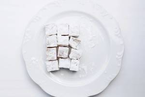 Turkish delight in a white plate. Top view.