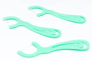Turquoise dental floss sticks