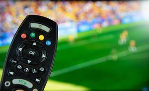 Tv remote control with football on the screen.jpg