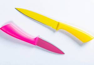 Two kitchen knives yellow and pink