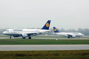 Two Lufthansa airplanes on the runway, Munich Airport