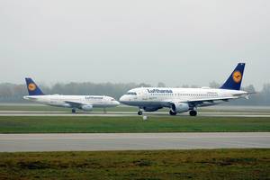 Two Lufthansa planes front to front in Munich Airport