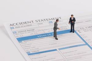 Two men with accident statement report