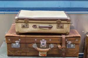 Two old retro style vintage suitcases made of brown leather