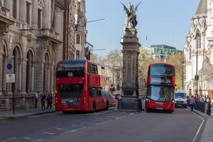 Two red buses and the Griffin by Charles Bell Birch